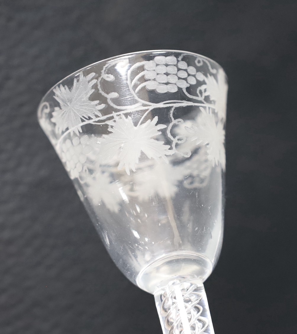 An 18th century engraved air twist stem wine glass, 15cm tall